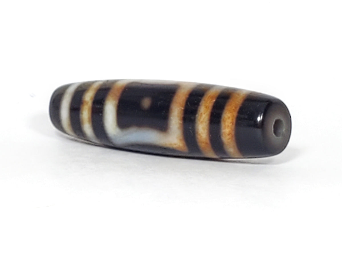 Antique Dzi bead Heaven's Gate Earth's Gate motif black white agate stripes bloodspots visible drill hole patina