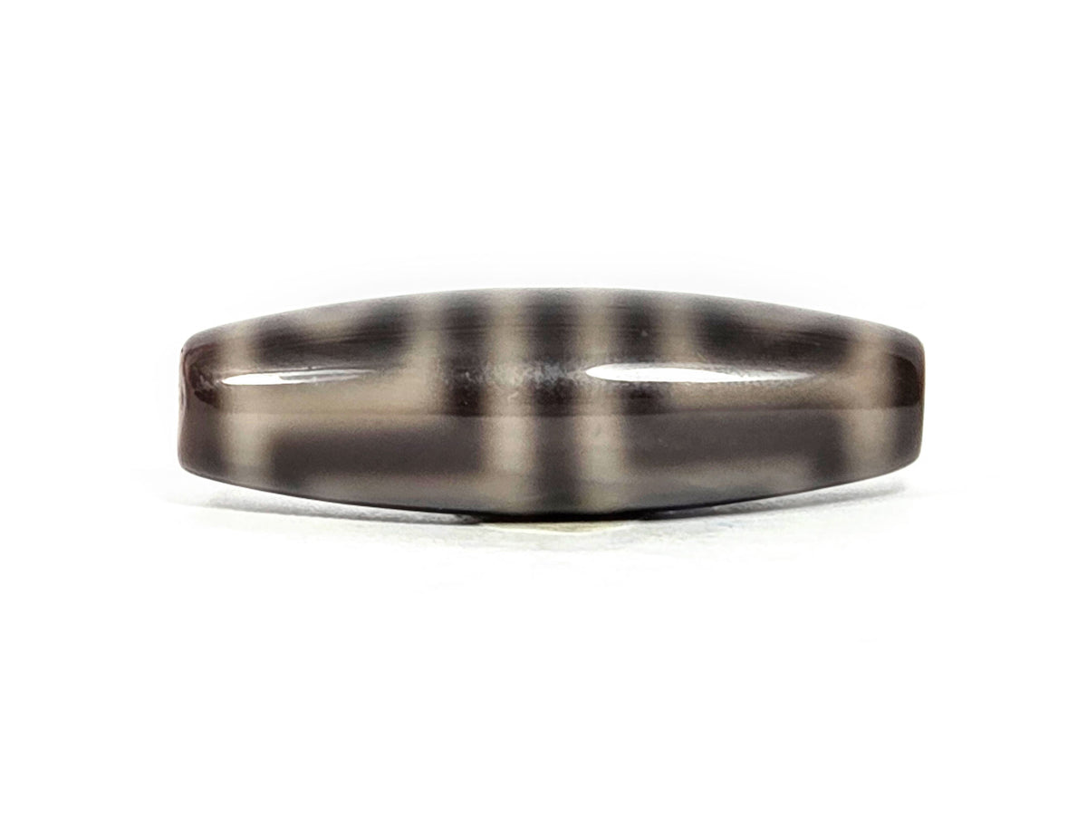N-071126-4EV face D, fourth side orientation, grey-cream zones diffuse at edges into dark grey-brown ground, unretouched