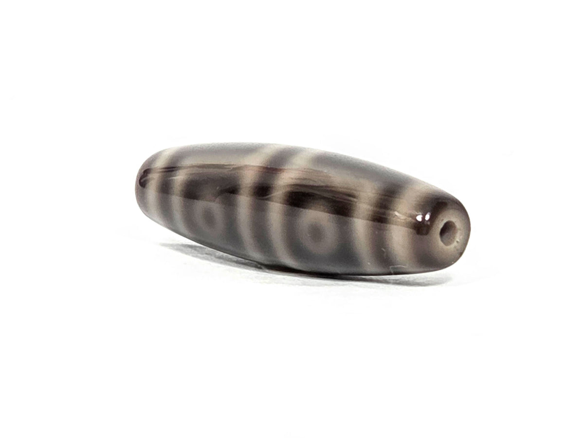 N-071126-4EV end view two, four eye rings visible on face from opposite end, second drill hole, grey-brown agate, unretouched