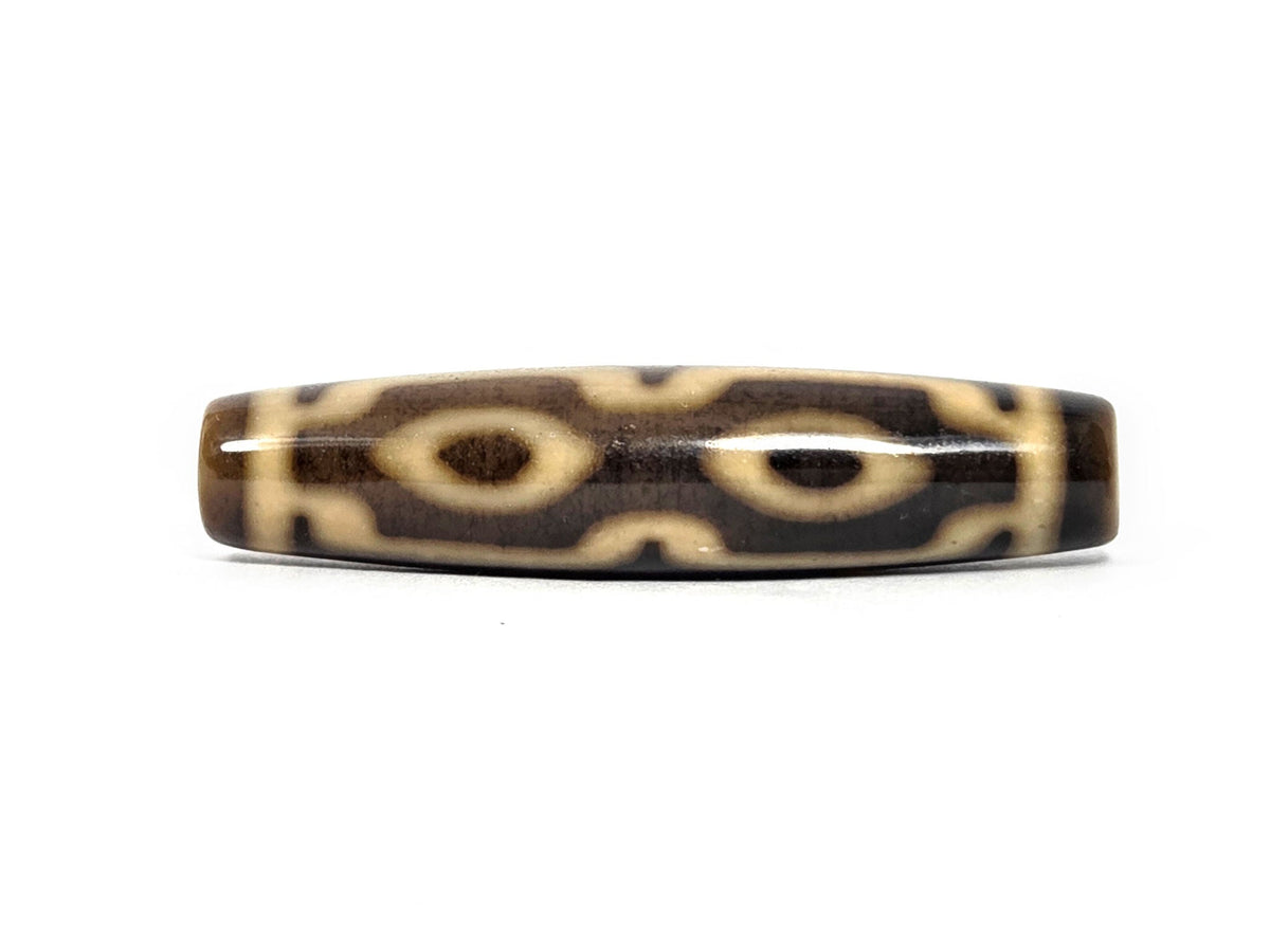 N-083126-4EV new four eye variant dzi 57.7x13.5mm warm brown agate almond eyes primary face unretouched