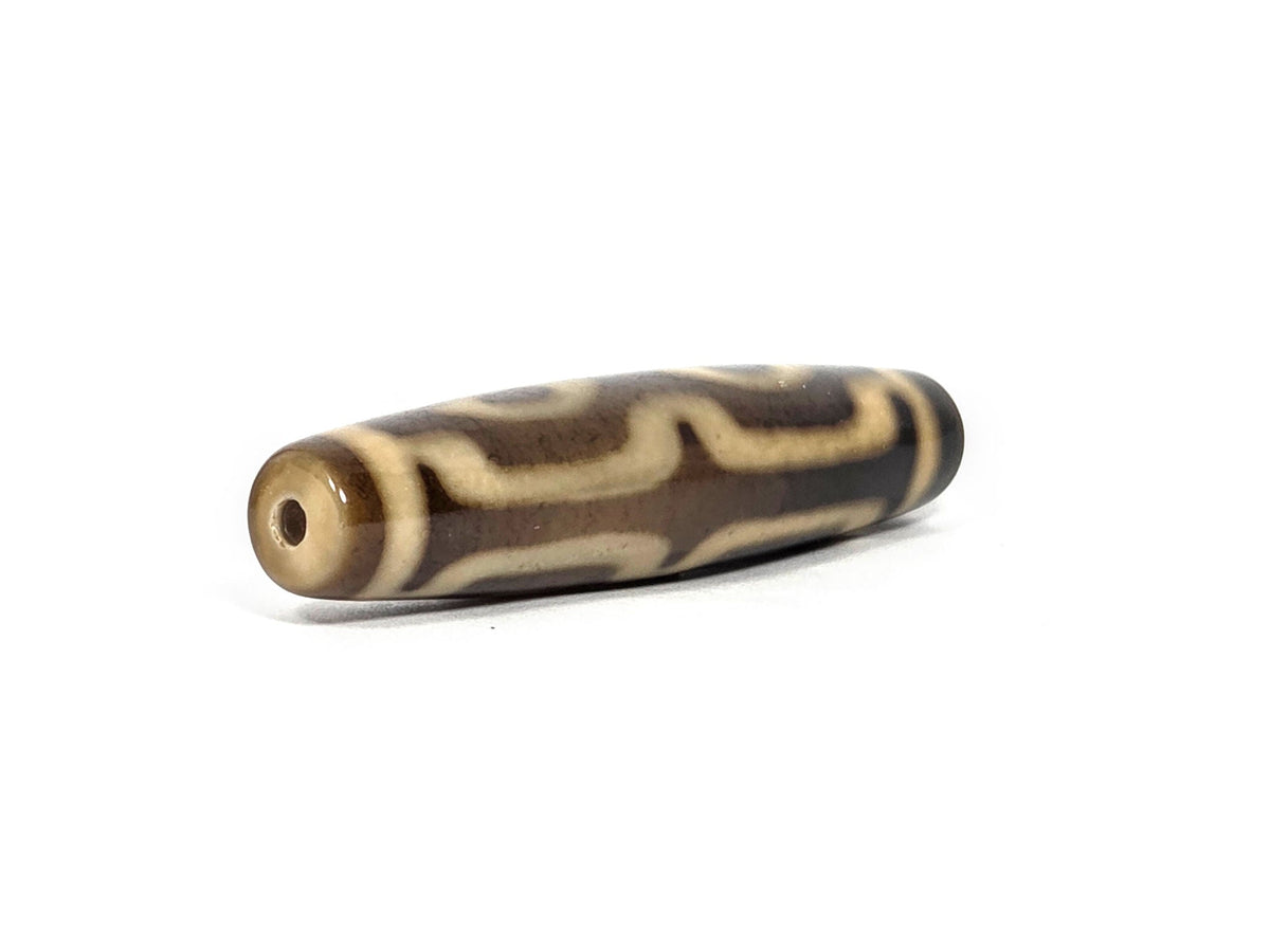N-083126-4EV new four eye variant dzi drill end view two honey-brown glossy tip fusiform unretouched