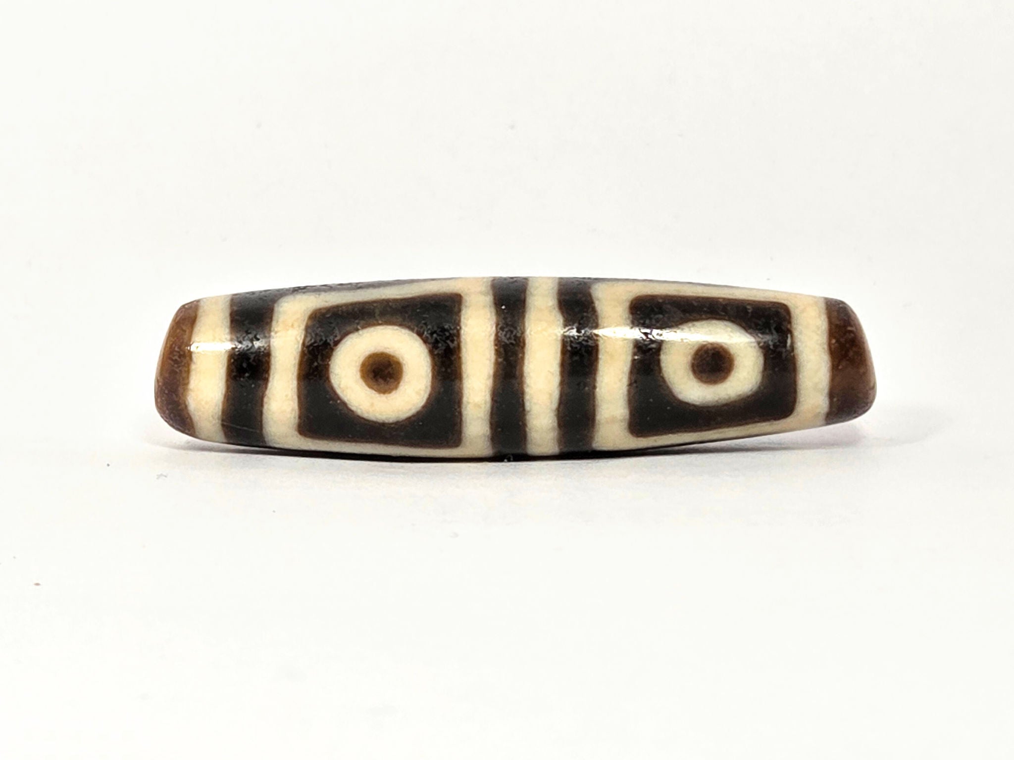 Four-Eye Dzi Bead: Meaning & Symbolism | Ancient Dzi Shop