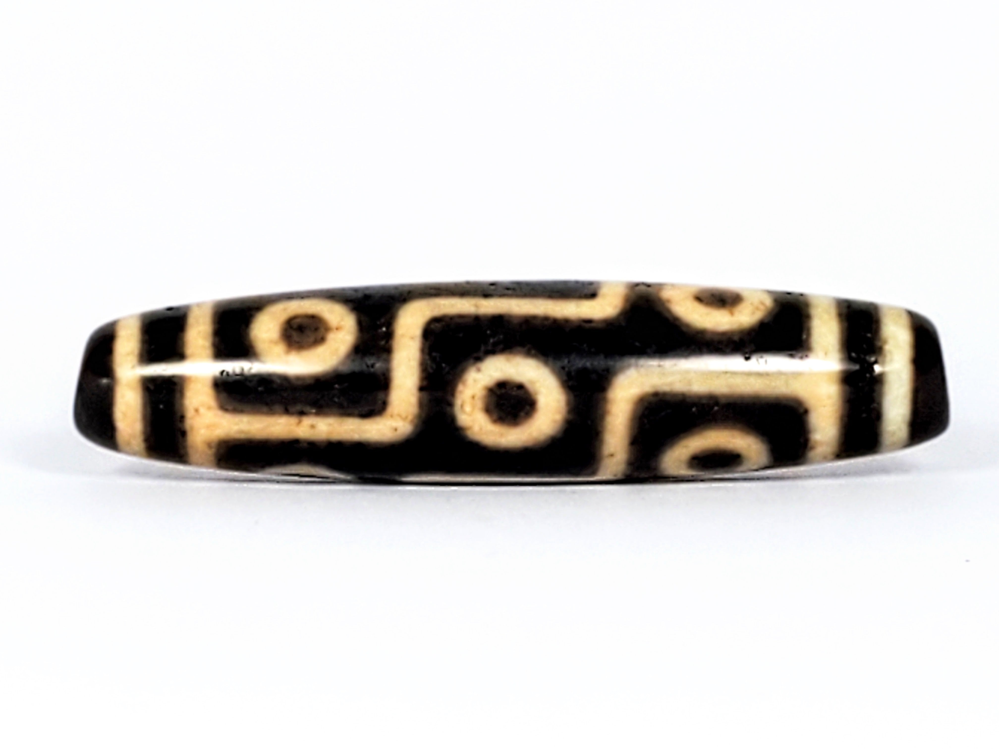 The Nine-Eye Dzi Bead: Symbolism and Significance – Ancient Dzi Shop