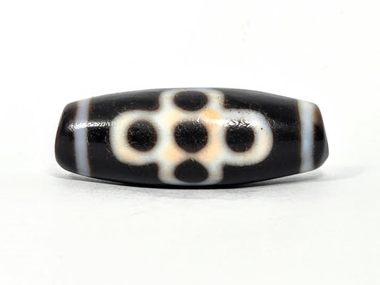 Antique Garuda healing dzi bead At-062026-5ELT, five eye face with cream meander on pitch-black agate, unretouched