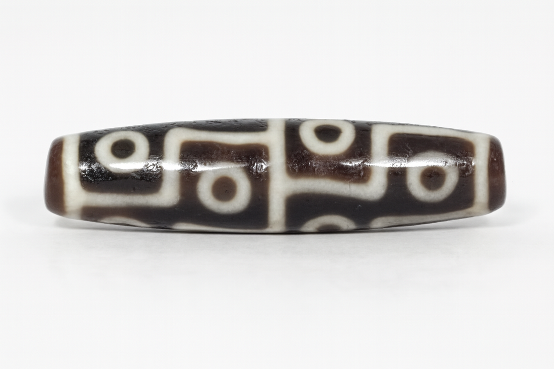Ancient Tibetan Dzi Bead adorned with twelve eye motif