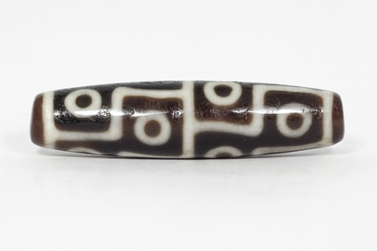 Ancient Tibetan Dzi Bead adorned with twelve eye motif