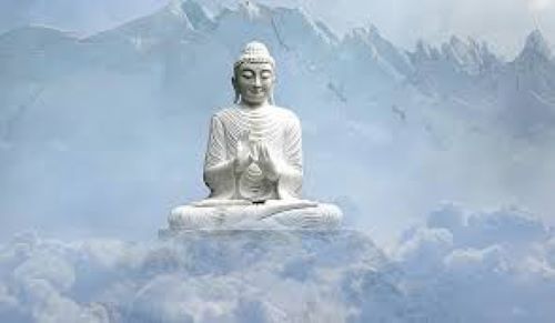 Person meditating while holding an ancient Tibetan dzi bead — spiritual practice and mindfulness