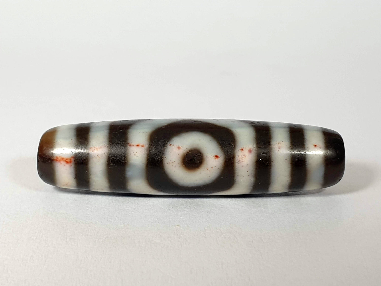 Three Eye Dzi Bead with Prominent Bloodspot Inclusions