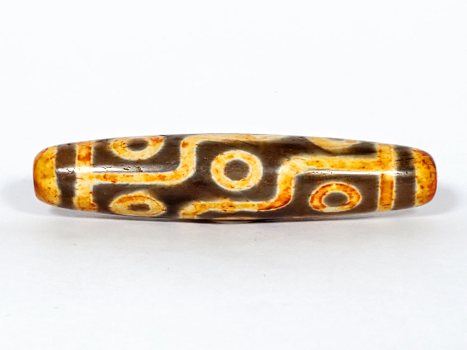 Faux antique nine eye dzi bead