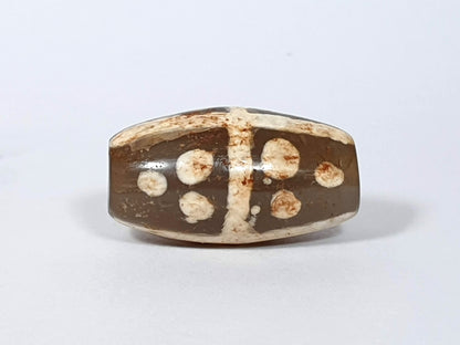 Ac-062426-18S Bead A angled view eighteen star motif medium warm brown agate ancient drill hole visible unretouched