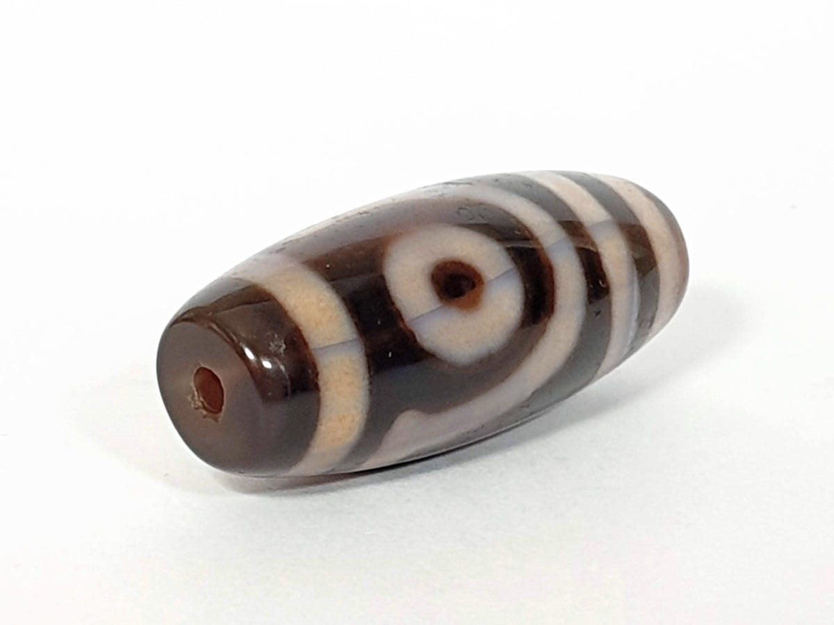 V-062926-DW drill-end angle 2, very dark brown dominant, cream chevron, standard drilling, vintage agate, unretouched