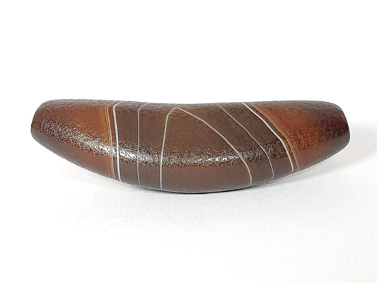 Bow shaped natural banded agate dzi bead with white stripe patterns and glossy brown surface finish