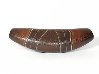 Bow-shaped natural banded agate dzi bead with white stripes and glossy brown surface
