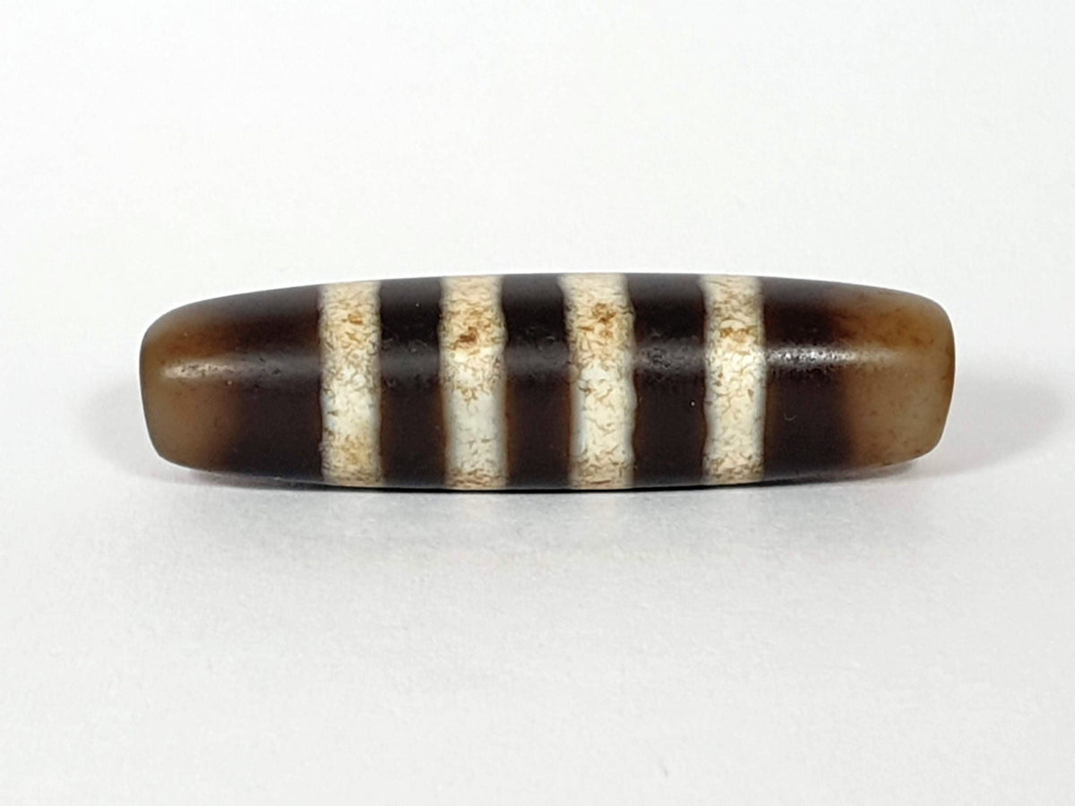 At-061920-7SChung antique seven stripe Chung dzi, Face B, translucent honey-brown end caps, warm ground, unretouched