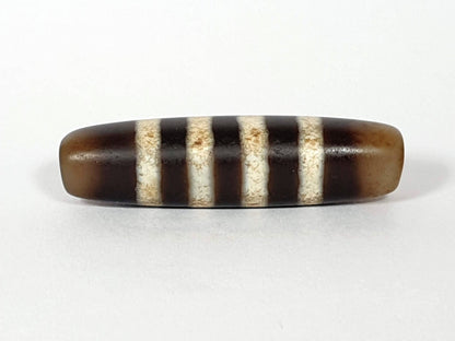 At-061920-7SChung antique seven stripe Chung dzi, Face B, translucent honey-brown end caps, warm ground, unretouched