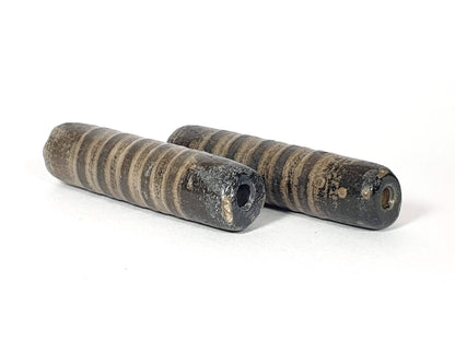 Ac-080420-19SChung, pair both beads, Bead A blue-green burial mineral deposit around drill hole, heavily weathered, unretouched