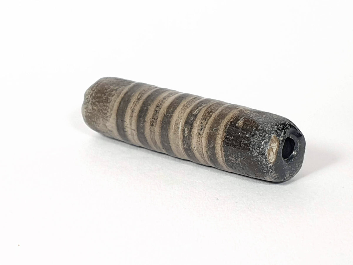 Ac-080420-19SChung, Bead A left end, blue-green burial mineral crust at drill hole, ancient cylindrical body, unretouched