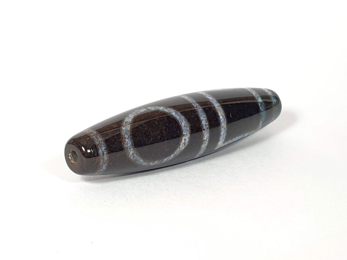 Double Heaven & Earth Dzi Bead with bloodspots, dark agate with blue-gray banding and natural patina