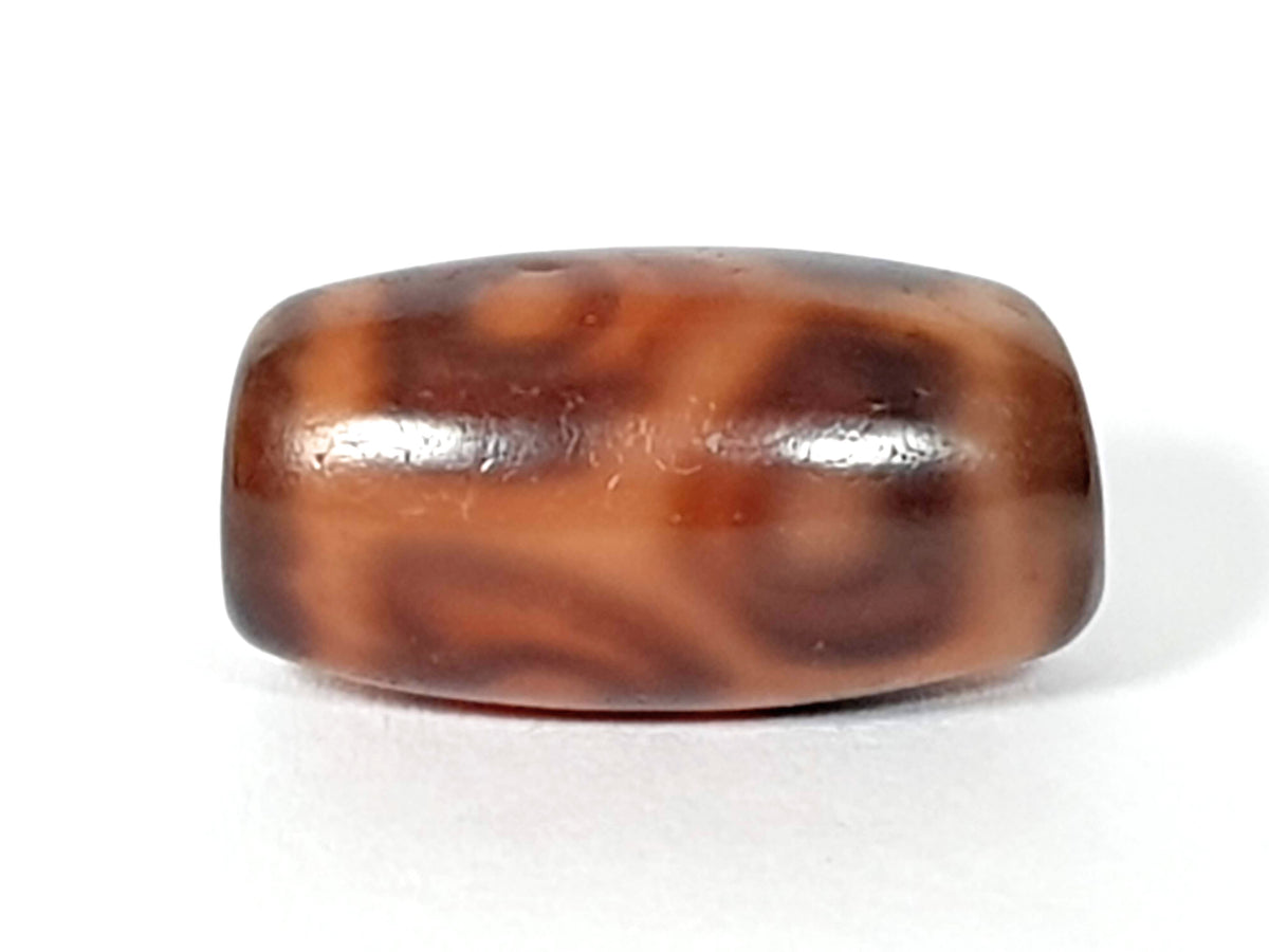 Antique six eye lotus dzi bead, brown agate with cream wave patterning, polished surface, natural patina, barrel shape