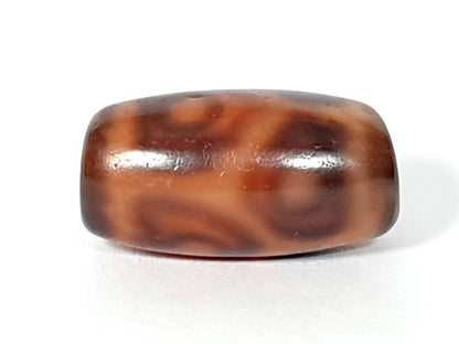 Antique six eye lotus dzi bead, brown agate with cream wave patterning, polished surface, natural patina, barrel shape