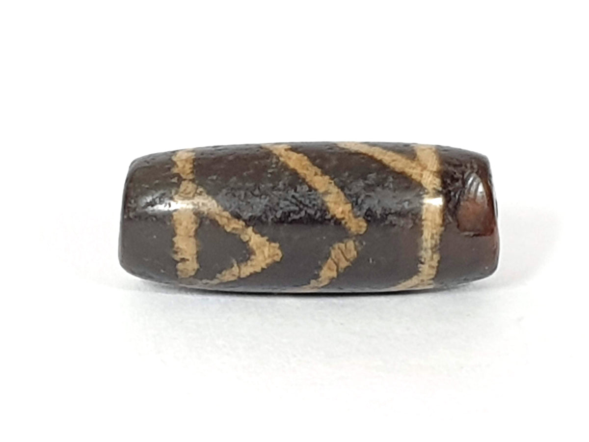 Ac-071026-CBEV2 ancient Indus Valley beveled carnelian 29.2mm face A dark inclusions chipping at right end unretouched