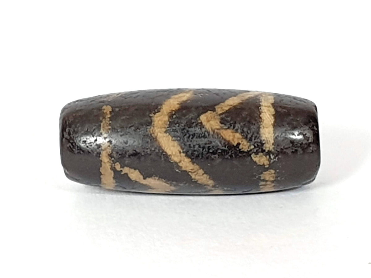 Ac-071026-CBEV2 ancient beveled carnelian orange-red face C large dark inclusion zones body intact unretouched
