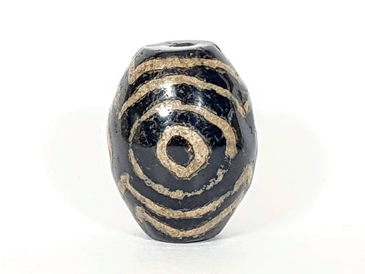 Ancient Triple Heaven's Gate Dzi Bead, dark agate, cream spiral motif, visible drill hole, aged patina, oval barrel shape