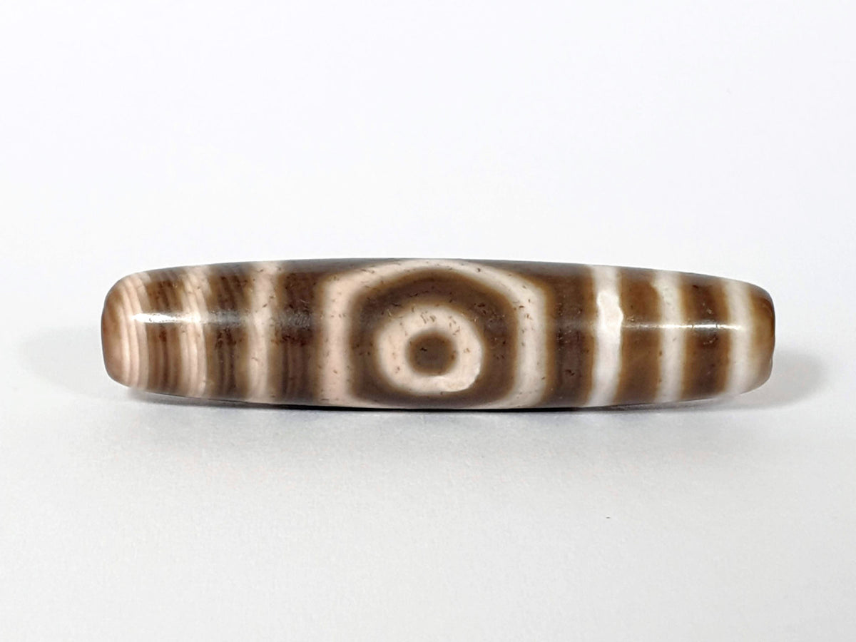 Qing Dynasty three eye dzi — front face, one large open eye centred, speckled cream zones, warm brown ground, At-0426-3EQ2