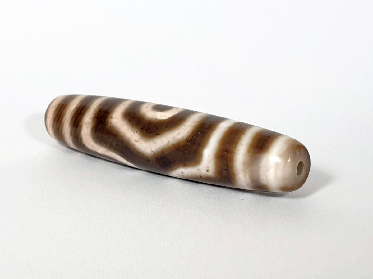 Qing Dynasty three eye dzi — angled end, drill hole at narrow dark tip, speckled cream and brown stripe pattern, At-0426-3EQ2