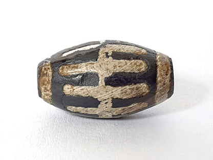 Ancient sun ray motif agate dzi bead with tan striping and natural patina, 1200-1500 years old