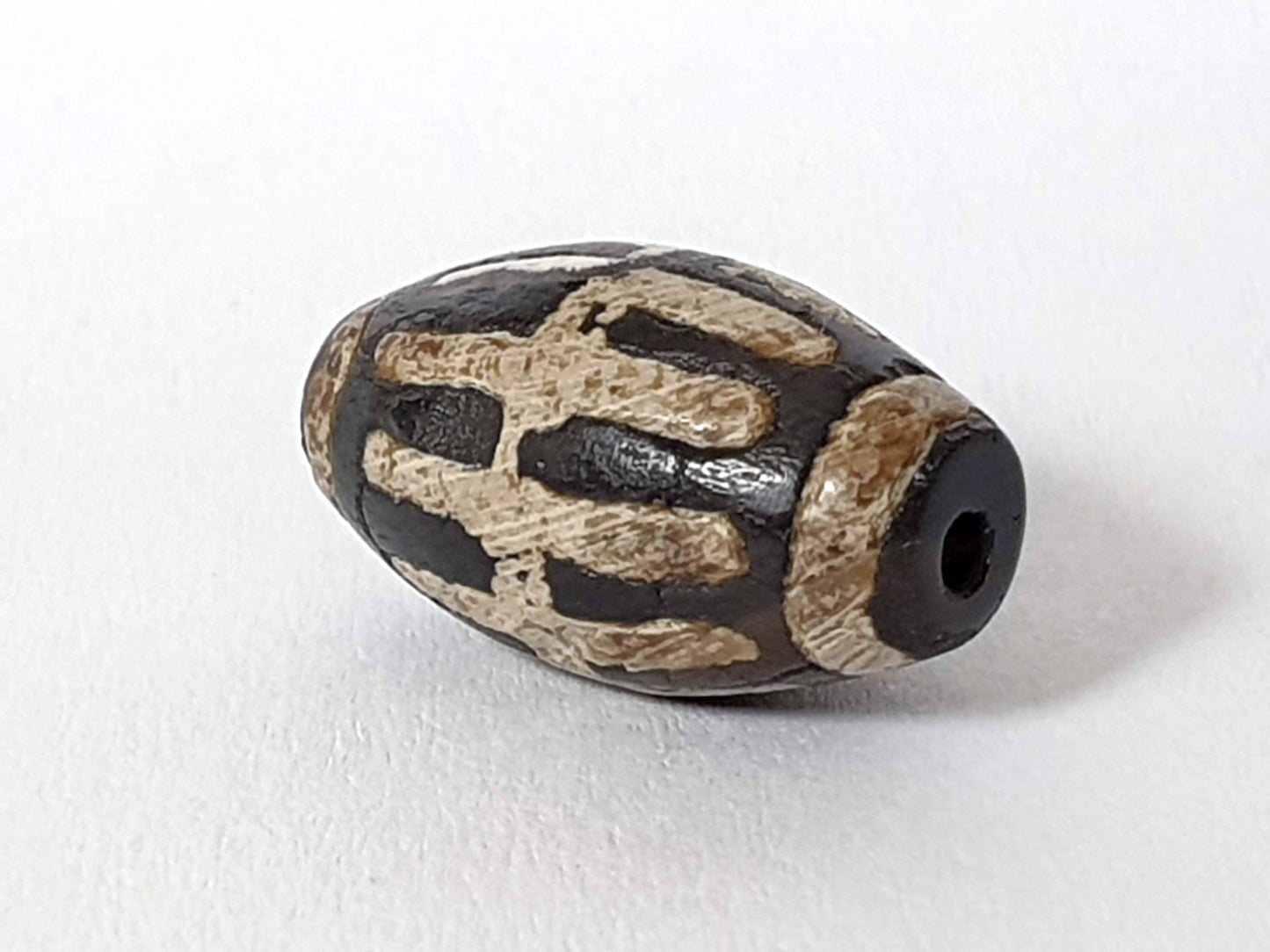 Ac-062426-SR Bead B deep dark warm brown ground raised cream sun ray bars end view drill hole unretouched