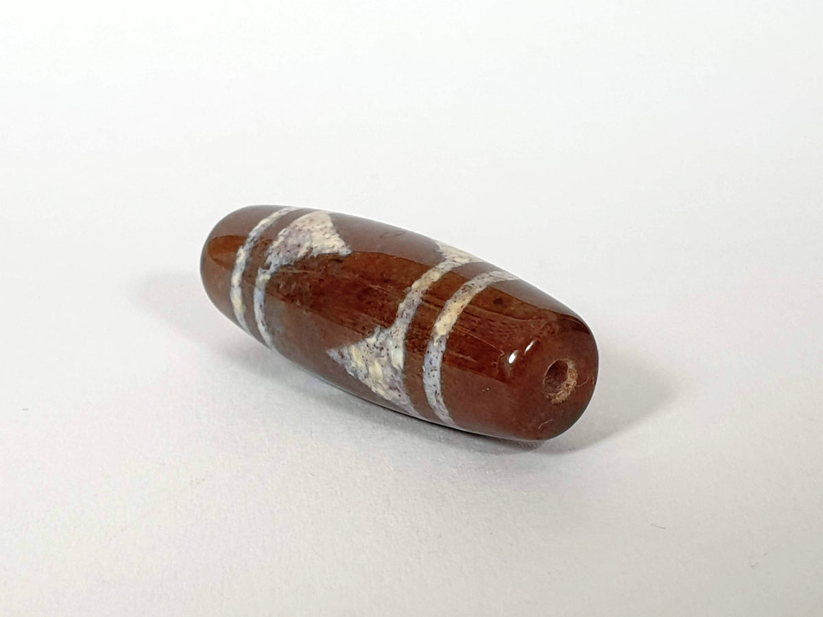 N-062426-TTBS Bead B tiger tooth dzi 39.5x13.7mm opposite end cool grey-brown drill hole natural agate variation unretouched