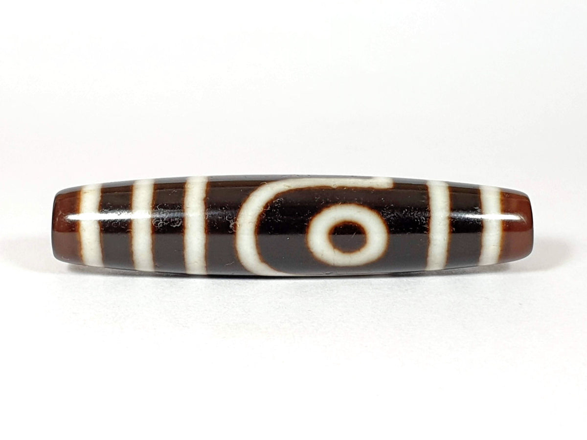 Vintage two-eye dzi bead, brown and black agate with white stripe pattern, 54.5mm, natural patina