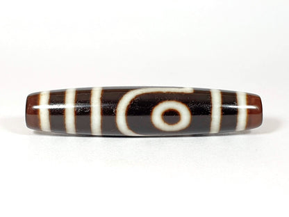 Vintage two-eye dzi bead, brown and black agate with white stripe pattern, 54.5mm, natural patina