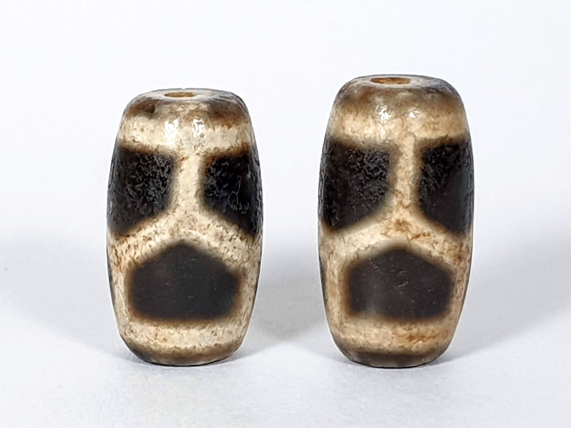 N-FA-062626-LG pair longevity tortoise shell agate dzi, front face, cream ground, 23.9×13.3 & 22.6×13.5mm, unretouched