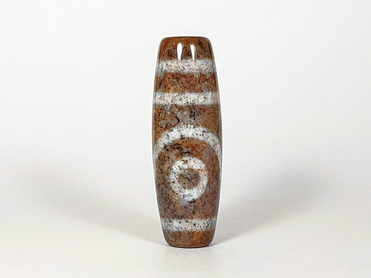 N-062126-2E2 New Two Eye dzi bead, full side profile, 58.4×13.7mm, cream ground, unretouched