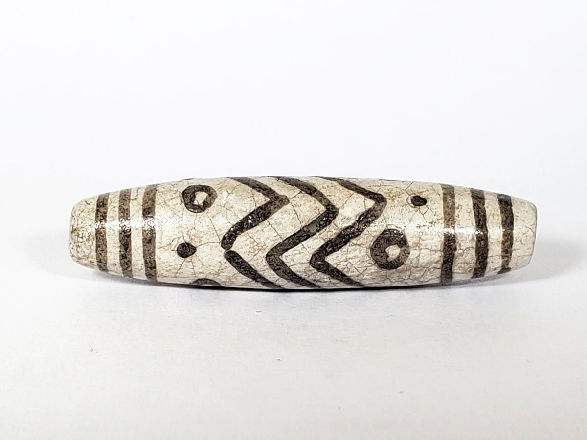 V-FA-062026-TESW face detail, chevrons and eyes, not an antique