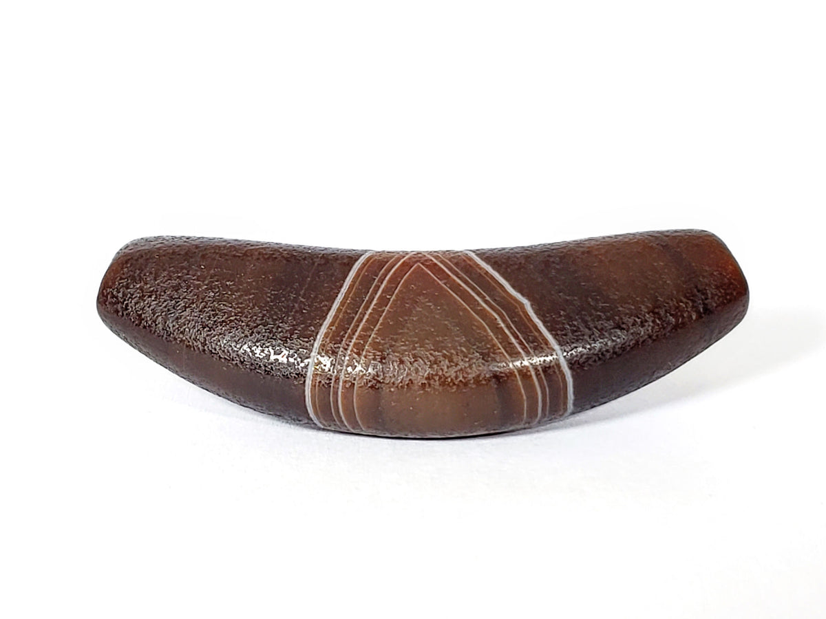 Bow-shaped natural banded agate dzi bead with white stripe pattern and polished brown surface