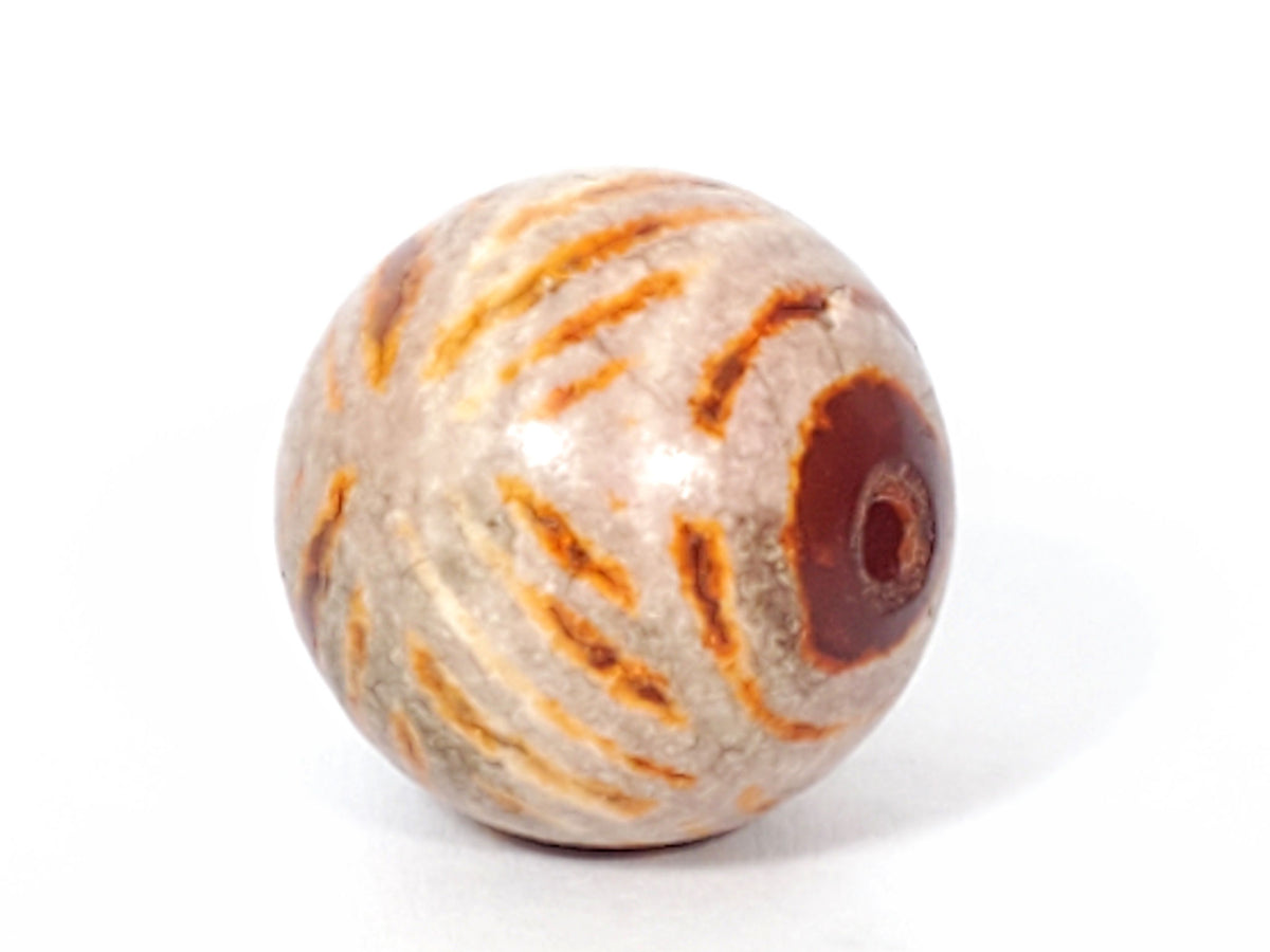 Ac-030623-DDIE ancient double diamond eye carnelian dzi, drill end view, dark carnelian zone, drill hole, unretouched