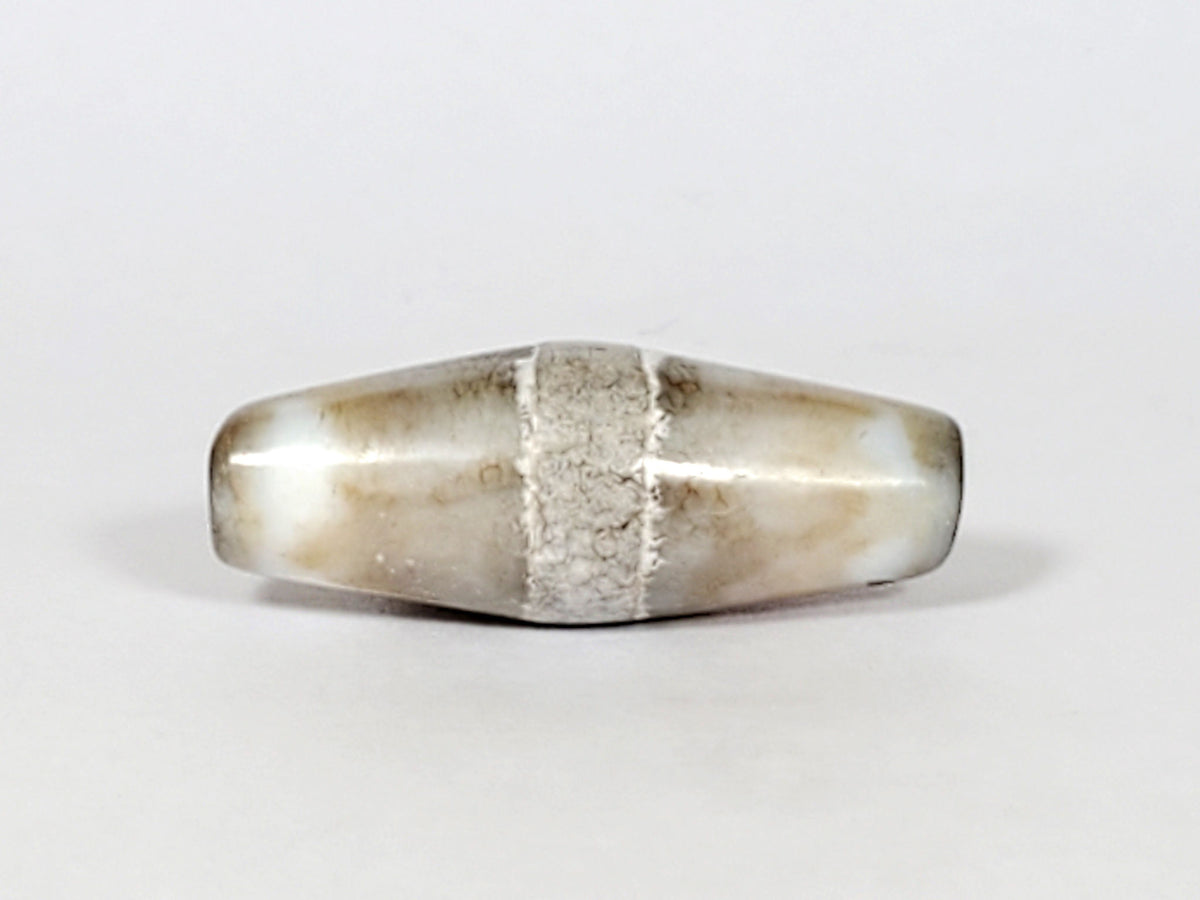 Ac-061526-1SPair, Bead A, 25.4×9.2mm, pale grey-white bicone, calcification stripe, honey-brown banding, unretouched