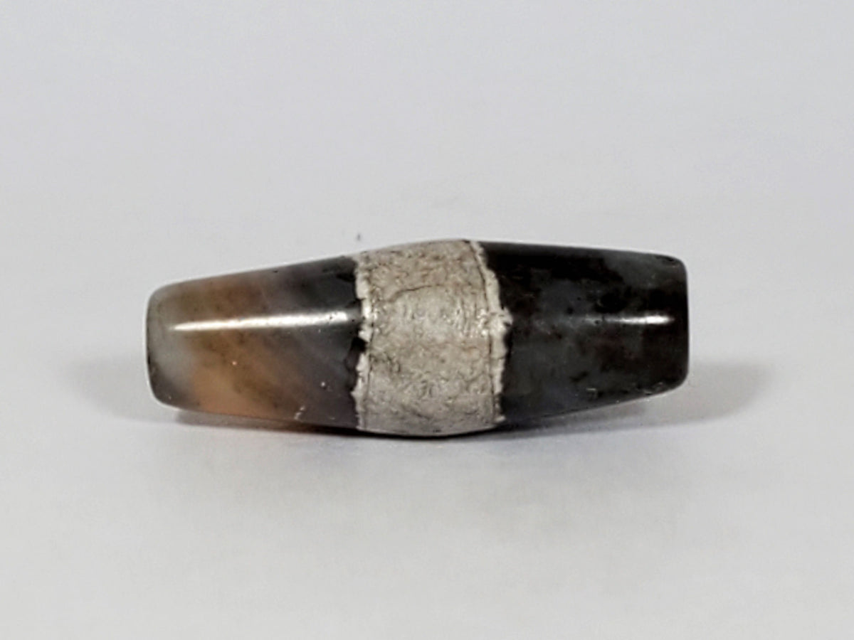 Ac-061526-1SPair, Bead A Face B, bicone shoulder ridge visible, calcification central zone, pale gloss ground, unretouched