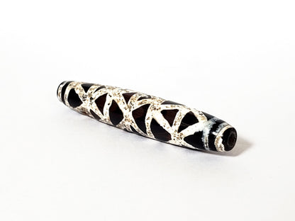 Ac-062426-CCX Bead A criss-cross carnelian dzi 49.2x9.1mm 500-700 yrs warm burgundy-brown ground drill hole unretouched