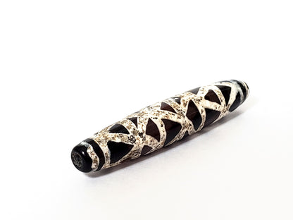 Ac-062426-CCX Bead A criss-cross carnelian dzi opposite end weathered cream lattice full coverage warm ground unretouched
