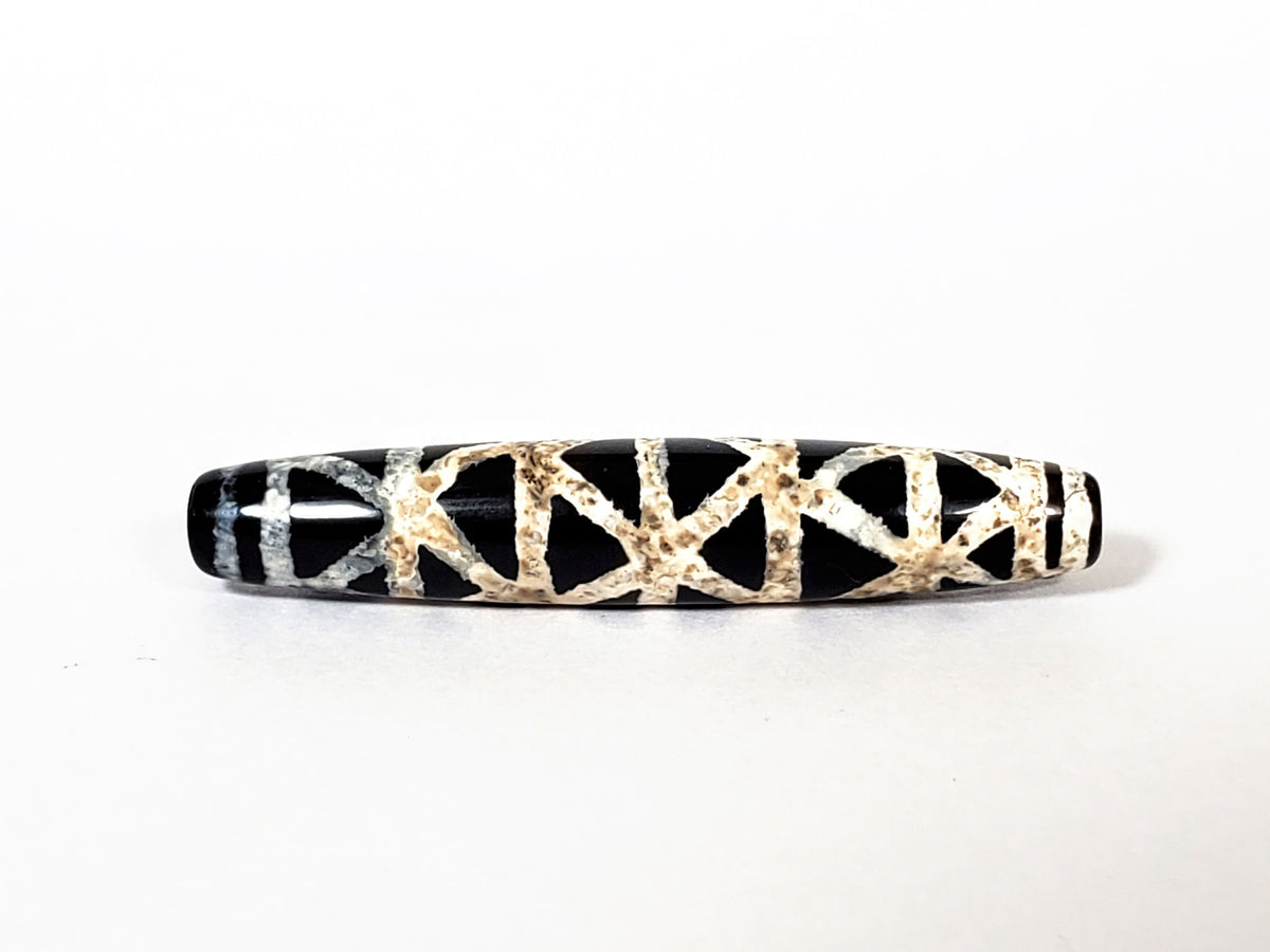 Ac-062426-CCX Bead B criss-cross carnelian dzi 48.9x9.1mm very deep near-black ground cream lattice unretouched