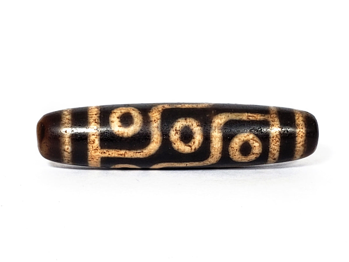 Vintage nine-eye dzi bead, agate with antique patina and gold striping, 57.4mm, drill holes visible