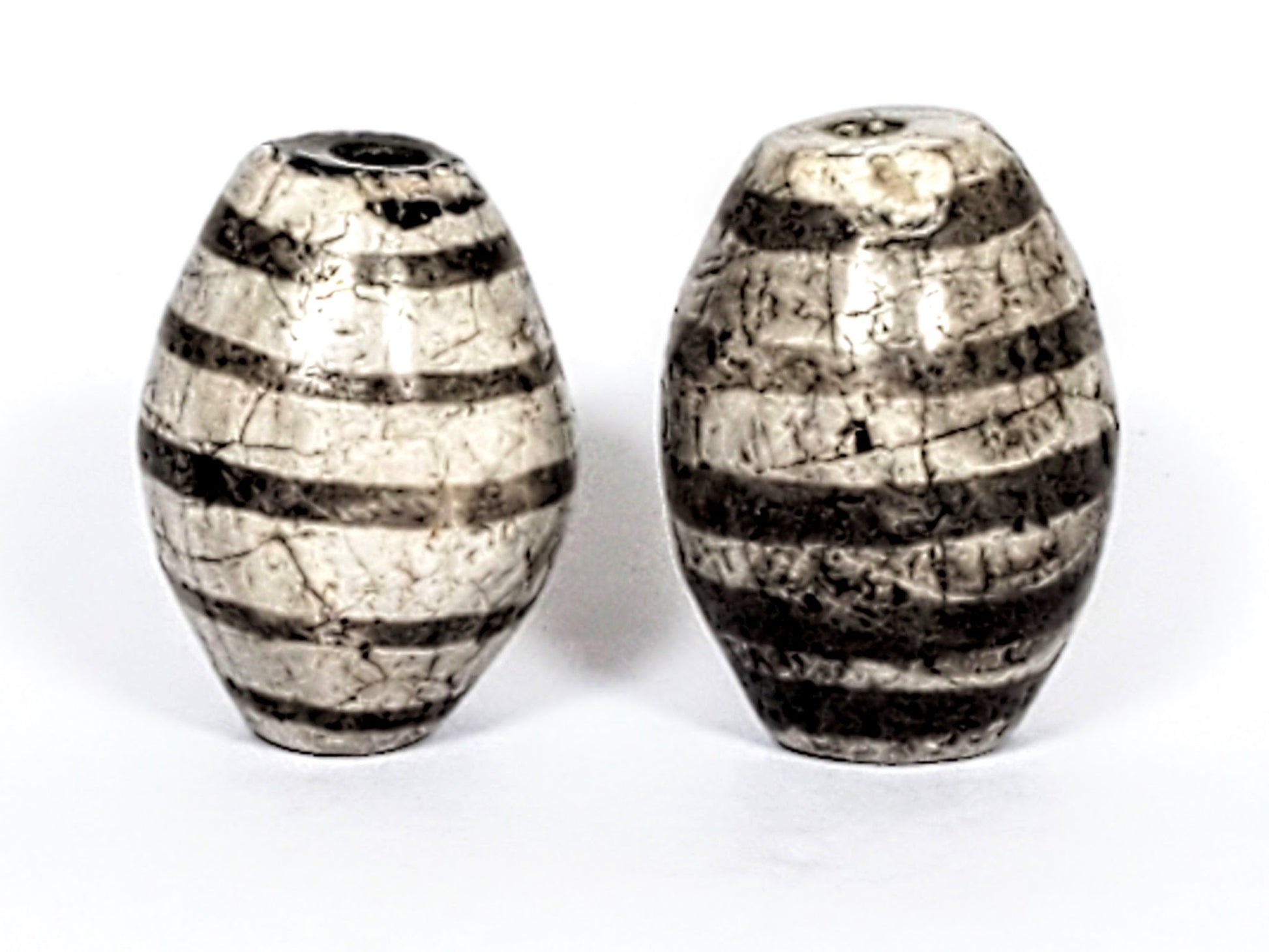 Ac-062626-9SChung2 pair ancient nine stripe Chung dzi, third face view, charcoal-grey stripe zones, cracklines, unretouched