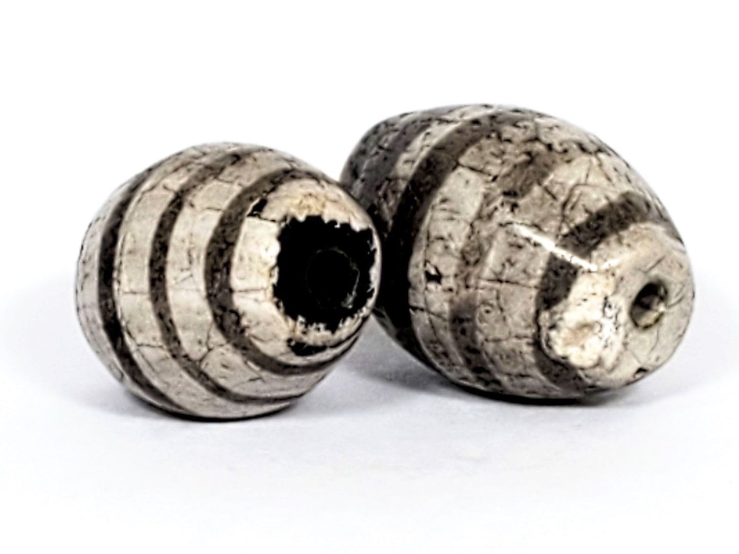 Ac-062626-9SChung2 pair ancient Chung dzi, drill end view, chip disclosed Bead A, dark end cap colouration, unretouched