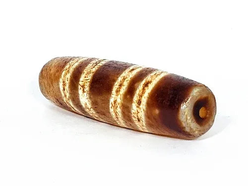 Ac-031322-7SChung, left end 3/4 view, warm honey-brown tip, drill hole, widest Chung dzi diameter in collection, unretouched