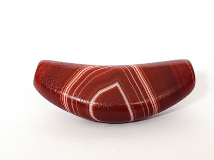 Red banded agate bow-shaped dzi bead with white stripes and natural patterns