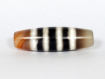 N-050222-7SChung, Face B lower profile, mirror-gloss black and white stripe composition, warm brown left end cap, unretouched